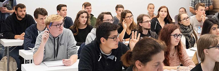 Students in a seminar room during a course