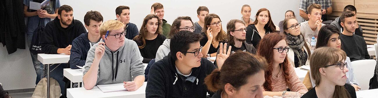 Students in a seminar room during a course